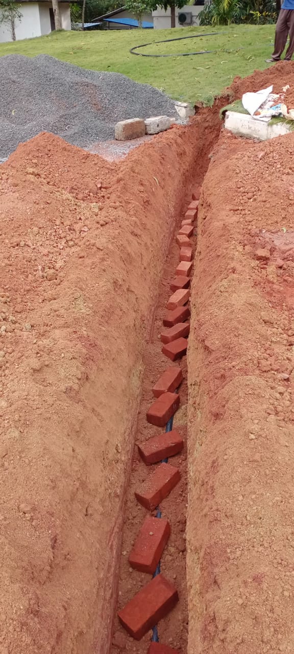 Underground cable trench with duct laid ready for backfill