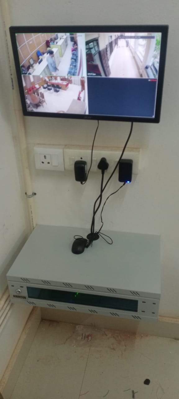 CCTV monitor showing four camera feeds
